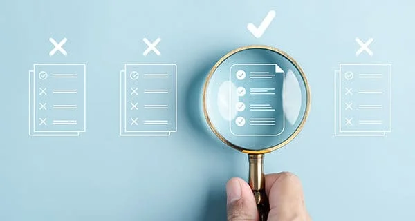 concept with hand holding magnifying glass over compliant document 1