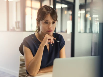 Woman-at-computer-creates-growth-strategy