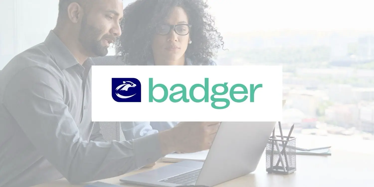 Graphic featuring an image of two colleagues working, with the Badger CPA logo overlaid on the image