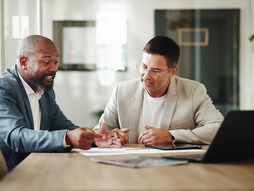 A SaaS company manager discusses monthly financials with his bookkeeper